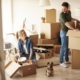 young couple packing moving boxes | 3GuysMoving.com