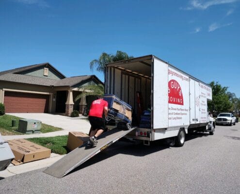 Supporting Your Movers 2 Carefully Loading Items into Moving Truck
